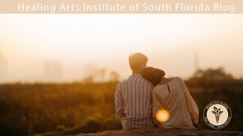 Healing Arts Institute - A happy couple enjoy each other's company watching the sun set.